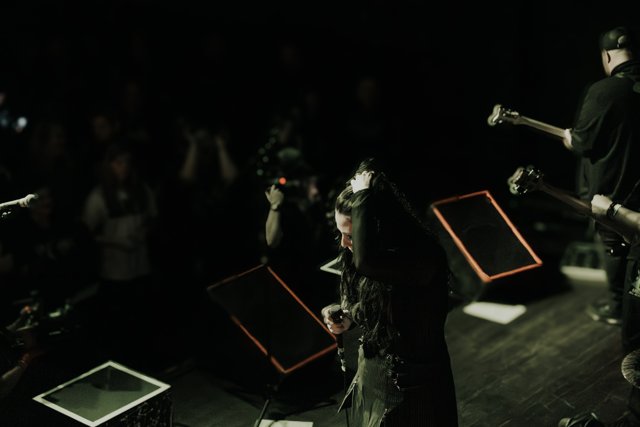 Sarah performing from a view beside the stage