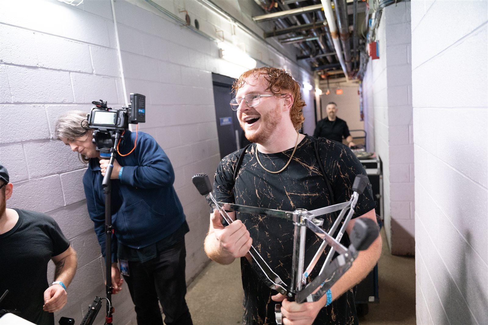 A candid backstage moment with a camera and equipment