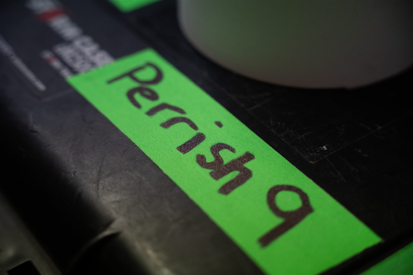 Perrish 9 written on green tape on a drum case