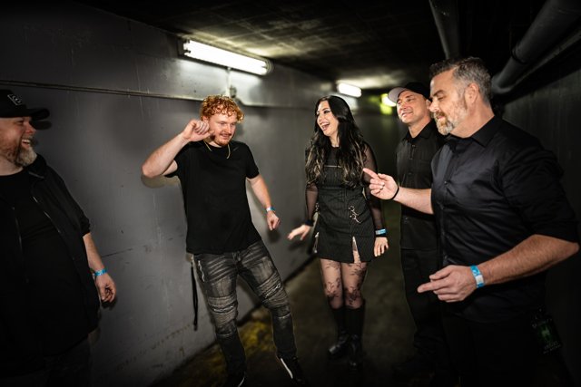Band members sharing a laugh backstage