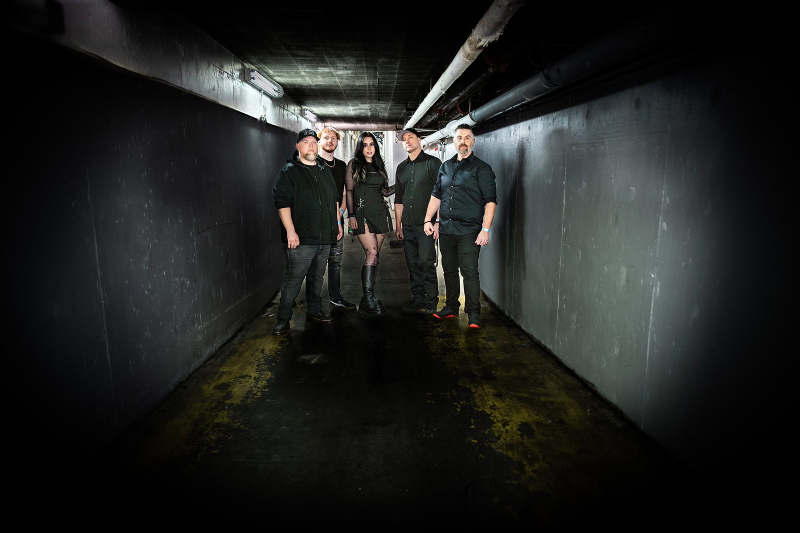 The band together in a dark corridor